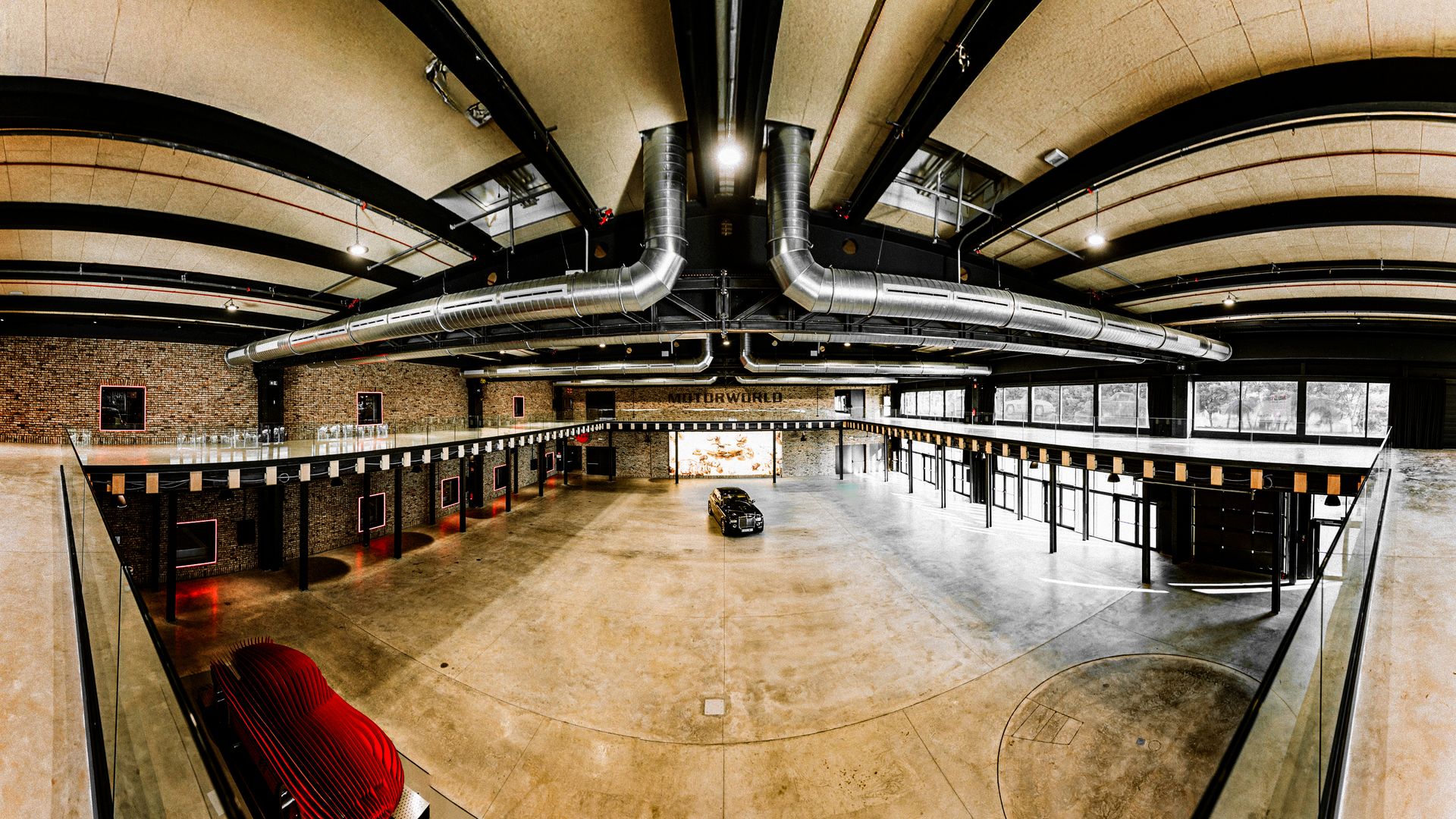 Motorworld - industrial venue with exposed ductwork and brick walls